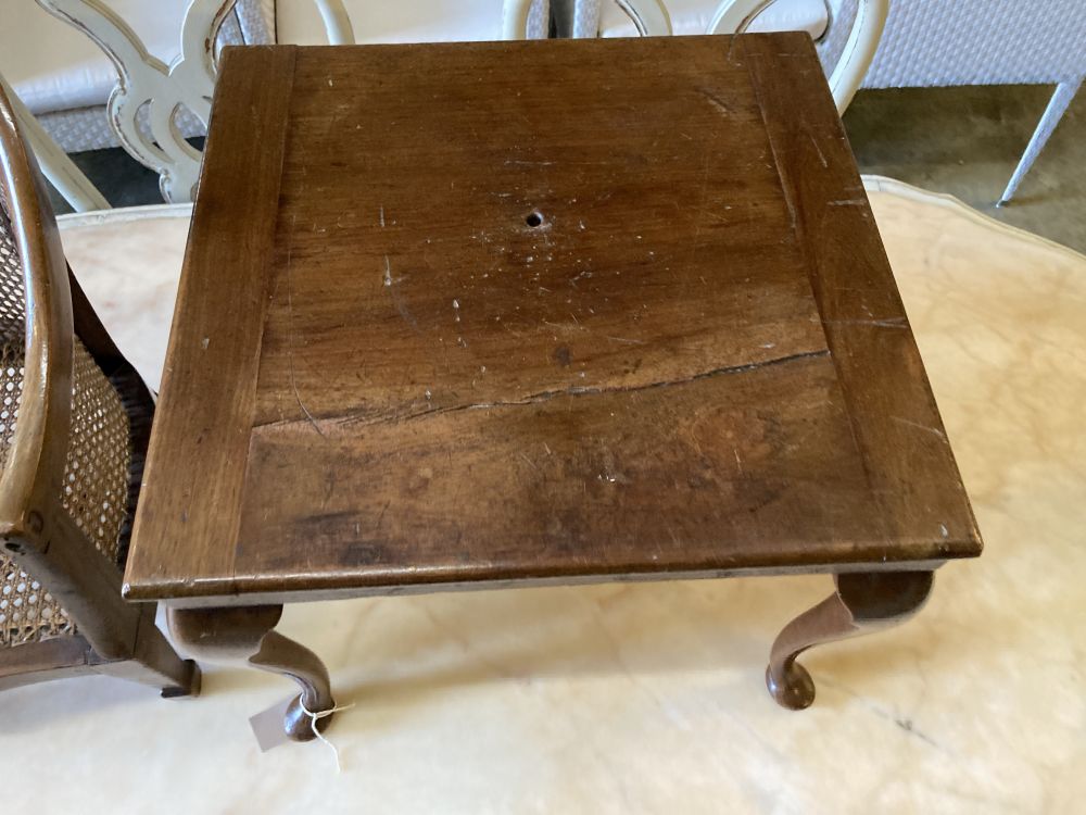 A childs caned mahogany bergere on table stand